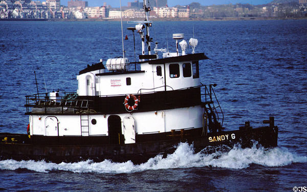 Tug boat in harbor of New York City. New York, NY.