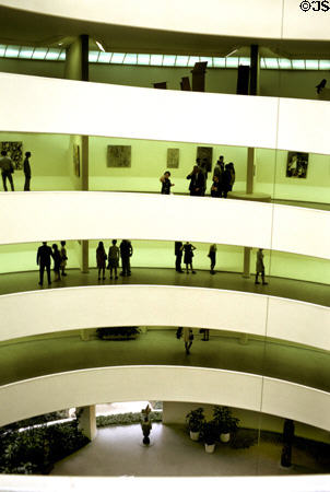 Guggenheim Museum spiral ramp interior seen from above displays modern art on a continuous surface. New York, NY.