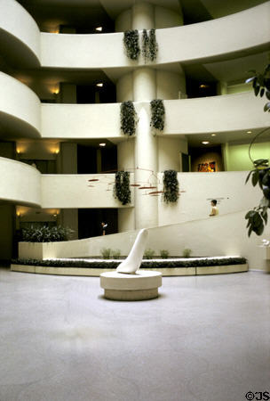 Guggenheim Museum spiral ramp rotunda seen from ground level with Calder mobile. New York, NY.