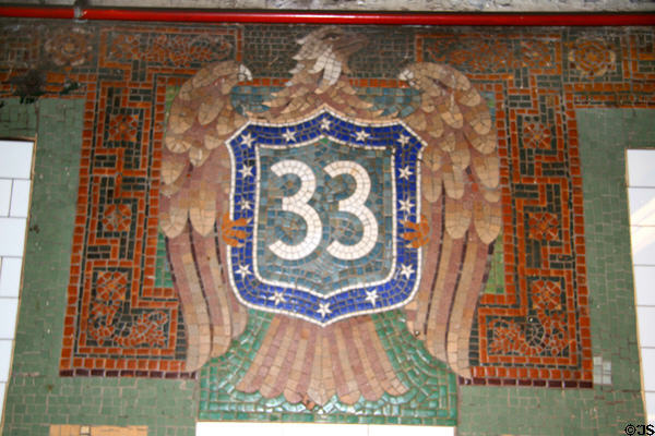 Eagle with #33 shield tiles in 33rd St. subway station done as a mosaic rather than solid tile. New York, NY.