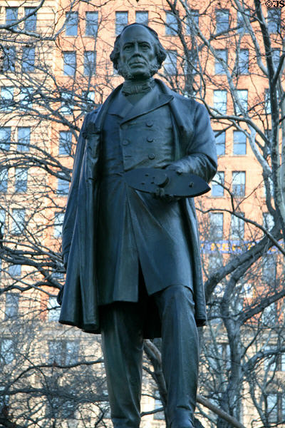 John Ericsson statue (1902) by Jonathan Scott Hartley holds Ironclad Monitor model which Ericsson designed. New York, NY.