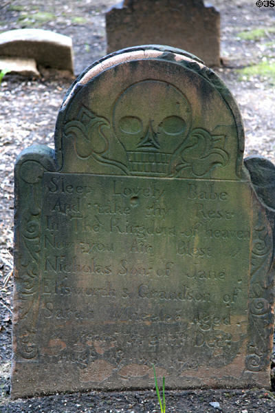 Tombstone (1730s) with skull in Trinity Church. New York, NY.