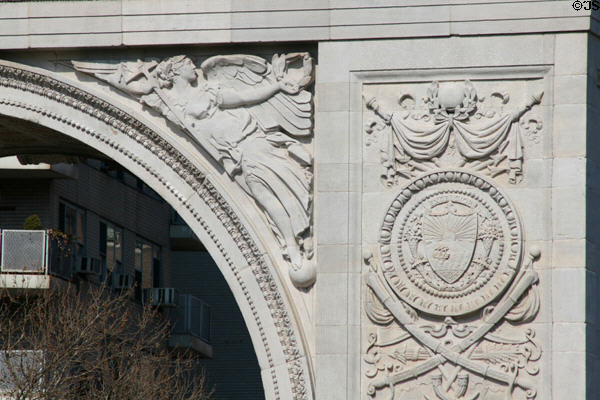 Washington Arch detail with angel holding victory wreath. New York, NY.