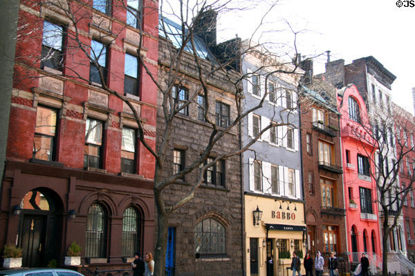 Townhouses along Waverly Place off Washington Square including #108 with crenellations dating back to 1826. New York, NY.