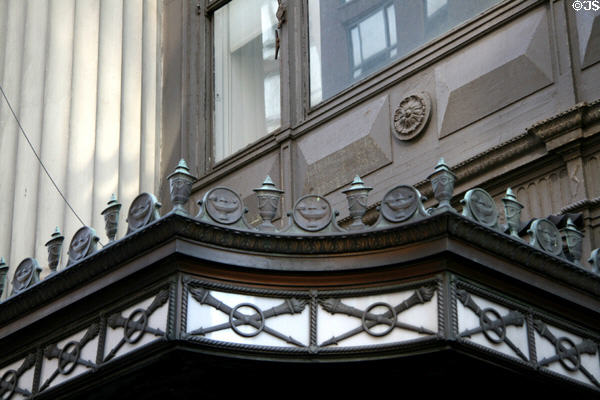 Metal overhang of Consolidated Gas Building with symbols of light. New York, NY.