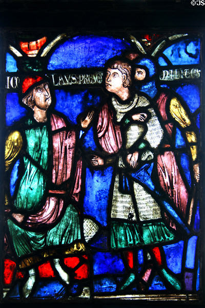 Stained glass (c1200) shows Saint Nicholas bishop of Myra saving three innocent Roman soldiers condemned to death from cathedral in Soissons, France at The Cloisters. New York, NY.