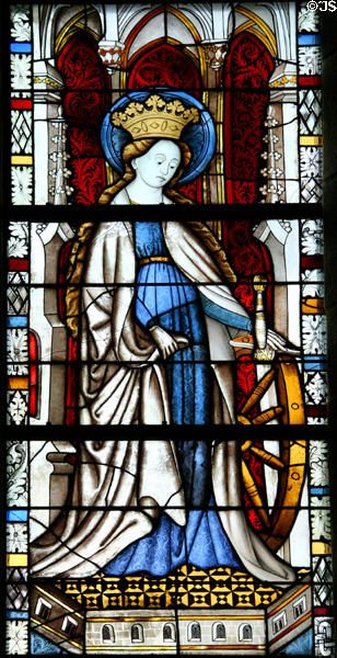 St Catherine of Siena with wheel of martyrdom stained glass (c1440) from the church at Boppard-am-Rhein at The Cloisters. New York, NY.