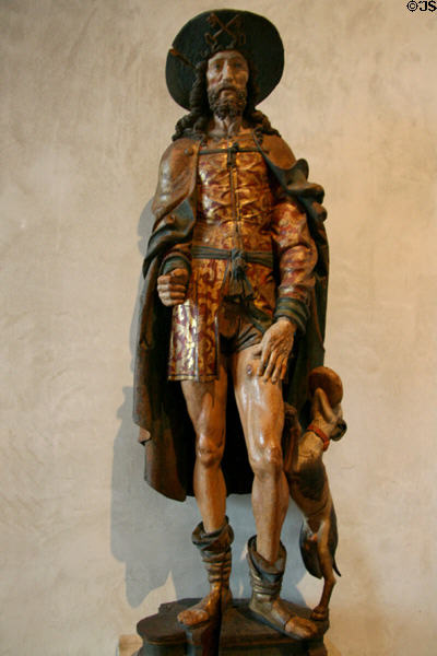 Gilded wood carving of St Roch with dog (early 16thC) from Normandy, France at The Cloisters. New York, NY.