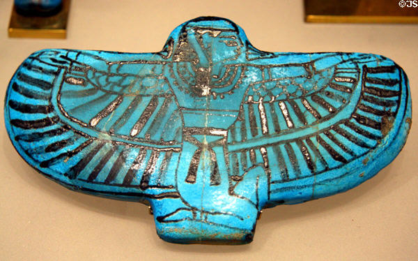 Funerary blue amulet of kneeling god with wings from Egypt early Ramesside period at Metropolitan Museum of Art. New York, NY.