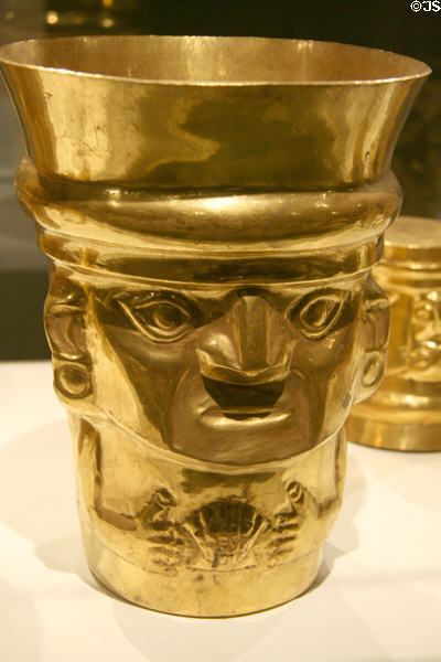 Lambayeque gold beaker of figure with shell (9th-11thC) from Peru at Metropolitan Museum of Art. New York, NY.