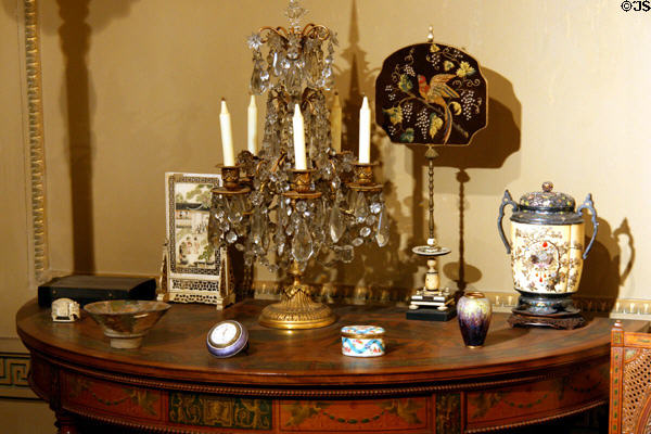 Side table with collected objects in Flagler alcove at Museum of the City of New York. New York, NY.