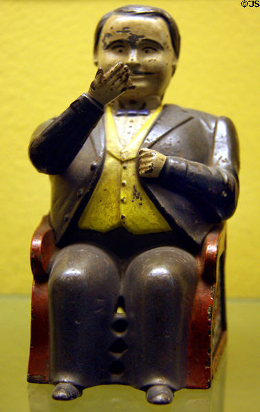 Tammany mechanical bank (c1873) portrays Boss Tweed who pockets coins by J.&E. Stevens Co. at Museum of the City of New York. New York, NY.