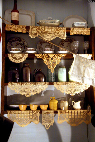 Kitchen shelves with dishes of German family (Gumpertz Apartment 1874) at Tenement Museum. New York, NY.