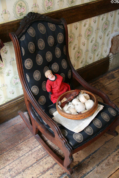 Rocking chair in front room of German family (Gumpertz Apartment 1874) at Tenement Museum. New York, NY.