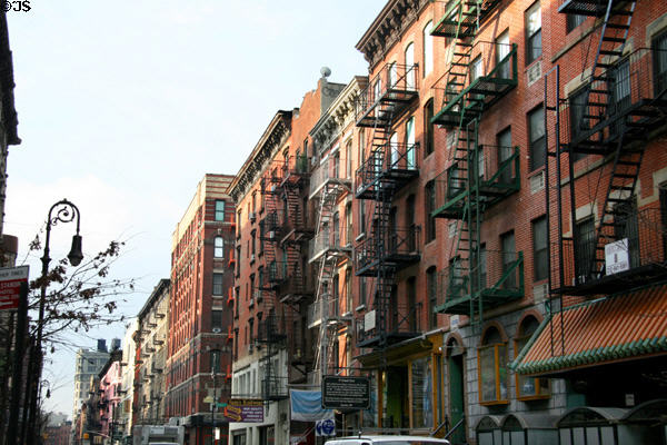 Streetscape along Orchard St. reflects New York of old including Tenement Museum. New York, NY.