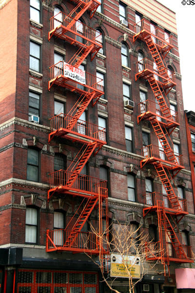 Heritage building with orange fire escapes (261 Orchard St.). New York, NY.