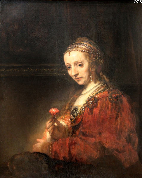 Woman with a Pink painting (early 1660s) by Rembrandt at Metropolitan Museum of Art. New York, NY.
