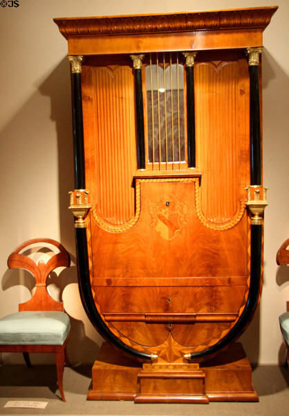 Secrétaire à Abattant (drop-leaf desk) which mimics organ in Biedermeier style (c1815-20) from Austria plus side chair of the era at Metropolitan Museum of Art. New York, NY.