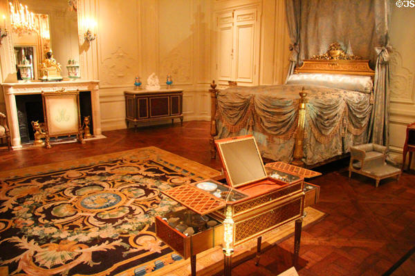 Lauzun Room (1770) with tester bed, dressing table, fireplace & carpet at Metropolitan Museum of Art. New York, NY.