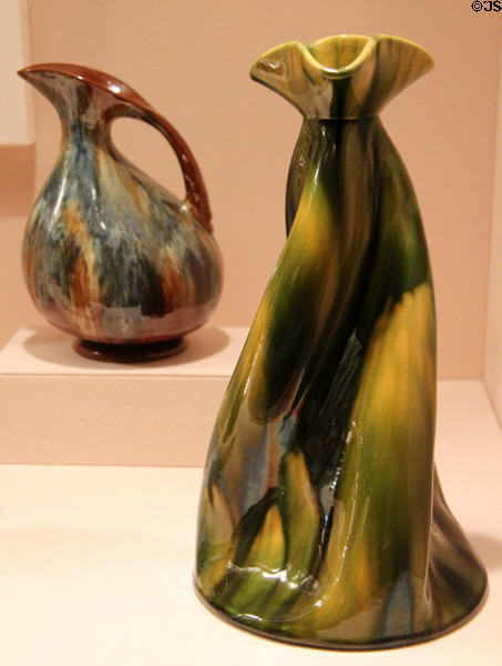 Christopher Dresser earthenware pitcher (1879-82) made by Linthorpe Pottery plus vase (c1893) made by Ault Pottery of England at Metropolitan Museum of Art. New York, NY.