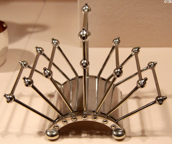 Silver plated toast rack (1881) by Christopher Dresser of Hukin & Heath of London at Metropolitan Museum of Art. New York, NY.
