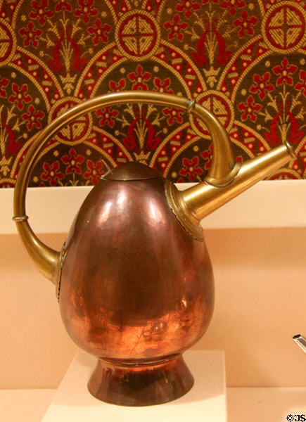 Copper & brass watering can (c1885) by Christopher Dresser for Benham & Froud of London at Metropolitan Museum of Art. New York, NY.