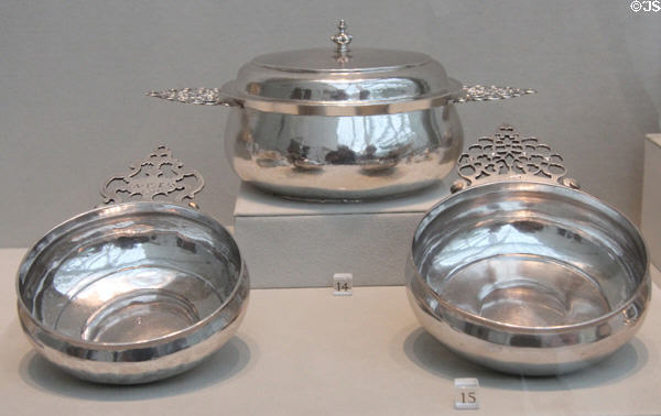 American silver porringers (early 1700s) by William Cowell Sr. of Boston; INK of New York City; & Peter Van Dyck of NYC at Metropolitan Museum of Art. New York, NY.
