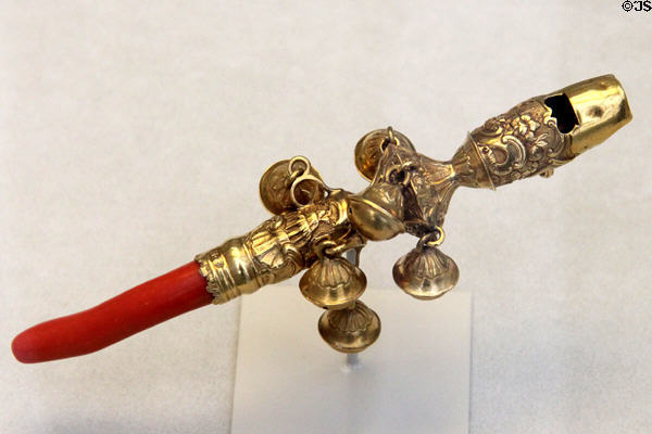 Gold & coral child's rattle, whistle & bells teething toy (1755-68) by Nicholas Roosevelt of New York City at Metropolitan Museum of Art. New York, NY.