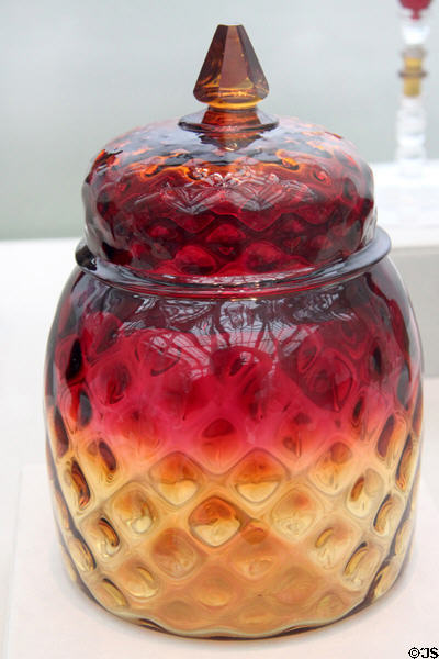 Amberina glass covered jar (1883-8) by Mount Washington Glass Co. of New Bedford at Metropolitan Museum of Art. New York, NY.