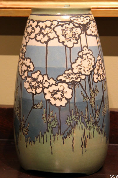 Earthenware vase with Queen Anne's Lace flowers (1915) by Sara Galner for Paul Revere Pottery of Boston at Metropolitan Museum of Art. New York, NY.