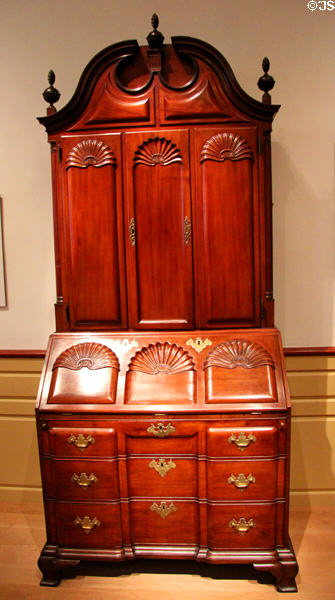 Desk & bookcase with heavy block & shell carvings (1760-90) from Newport, RI at Metropolitan Museum of Art. New York, NY.