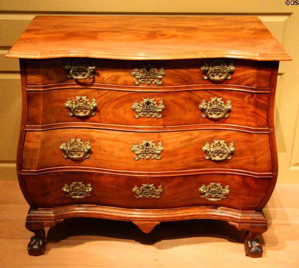 Chest of drawers with bombé curve (1770-90) from Boston, MA at Metropolitan Museum of Art. New York, NY.