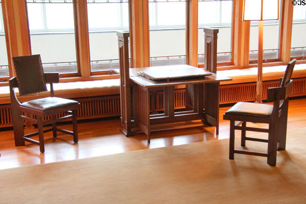 Table & truncated armchairs with square back in Frank Lloyd Wright room (1912-4) from Wayzata, Minn. at Metropolitan Museum of Art. New York, NY.