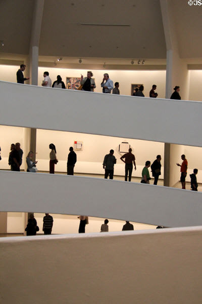 Visitors view modern art at Guggenheim Museum. New York City, NY.