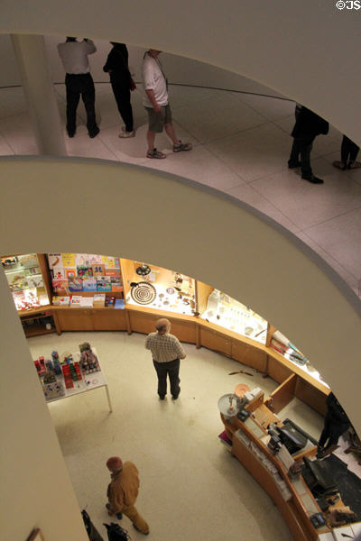 Variable use of Wright's space of Guggenheim Museum. New York City, NY.