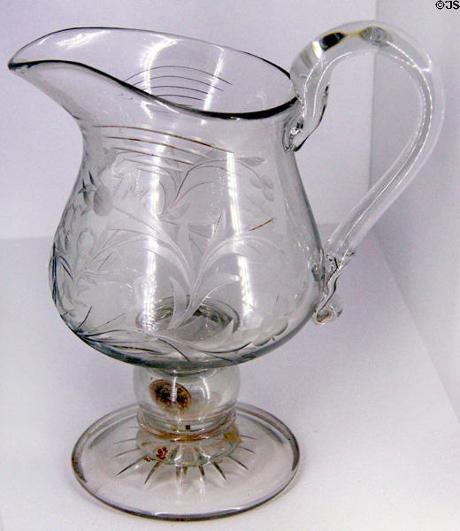 Blown glass pitcher with coin in stem (after 1845) by Thomas Leighton at Brooklyn Museum. Brooklyn, NY.