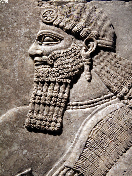 Detail of Assyrian relief of winged genie with fancy bracelets (883-859 BCE) from King Ashur-nasir-pal II palace of Nimrud at Brooklyn Museum. Brooklyn, NY.