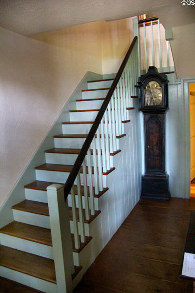 Staircase with tall clock at Conference House. Staten Island, NY.