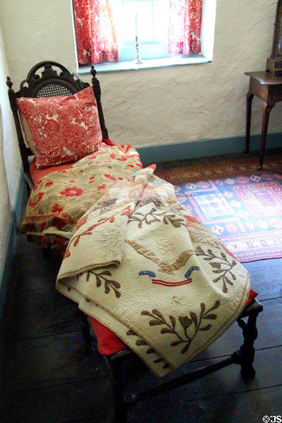Chaise longue with early American quilt at Conference House. Staten Island, NY.