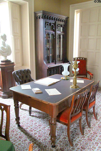 Library table with lamps & chairs & bookshelves (c1840s) at Lindenwald. Kinderhook, NY.