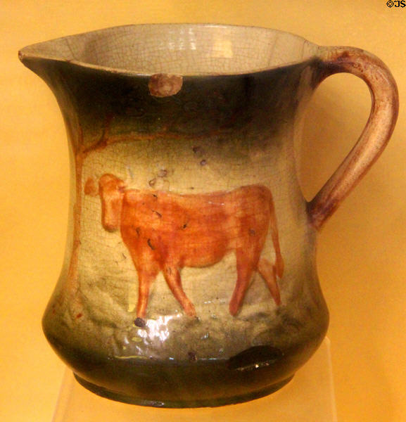 Ceramic pitcher painted with cow from Long Island at Old Bethpage Village. Old Bethpage, NY.
