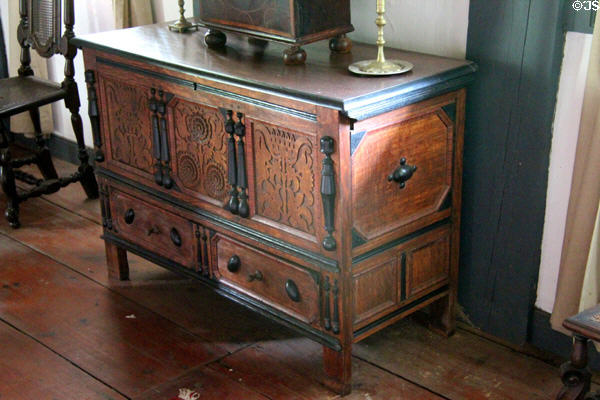 Connecticut-style chest with one drawer & carved sunflower (late 17th - early 18thC) in Schenck House parlor at Old Bethpage Village. Old Bethpage, NY.