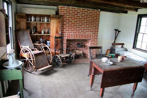 Searing Doctor's Office interior with antique wheelchairs at Old Bethpage Village. Old Bethpage, NY.