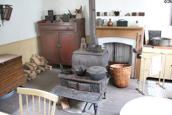 Kitchen with cast iron stove in Layton Home at Old Bethpage Village. Old Bethpage, NY.