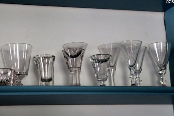 Early American drinking glasses in Noon Inn Barroom at Old Bethpage Village. Old Bethpage, NY.