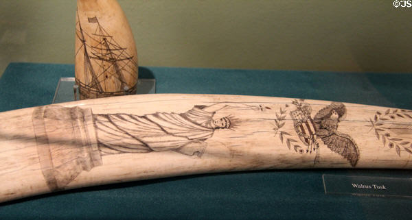 Scrimshaw Statue of Liberty etched on walrus tusk at Whaling Museum. Cold Spring Harbor, NY.
