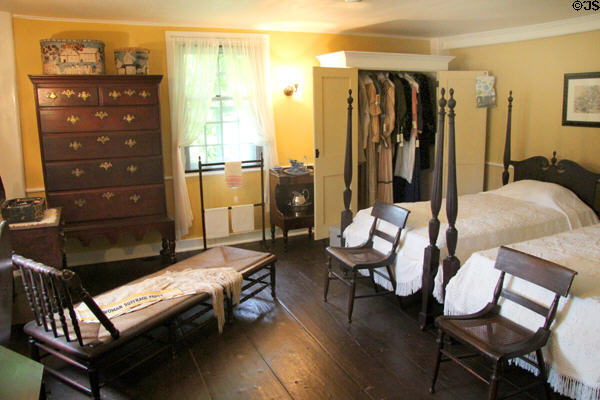 Bedroom with four poster beds, chaise lounge & high boy dresser at Home Sweet Home Museum. East Hampton, NY.