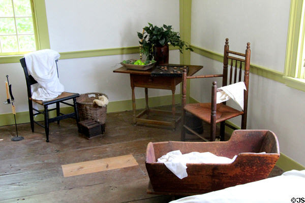 Cradle & sitting area with antique furnishings at Thomas Halsey Homestead. South Hampton, NY.