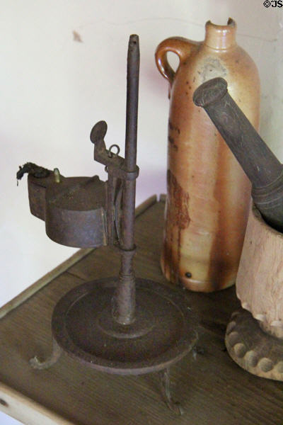 Betty oil lamp on adjustable height stand at Thomas Halsey Homestead. South Hampton, NY.