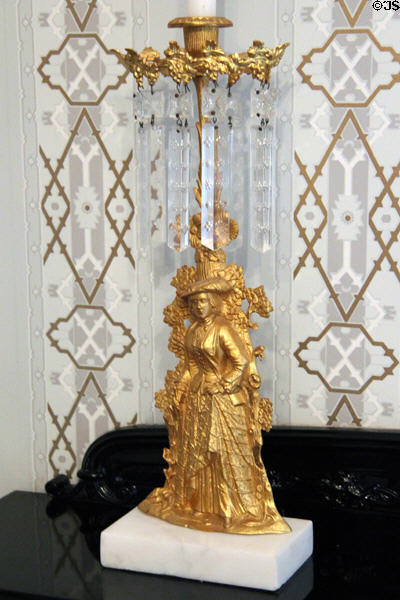 Gilt girandole with relief of woman in fancy dress at Taft House NHS. Cincinnati, OH.